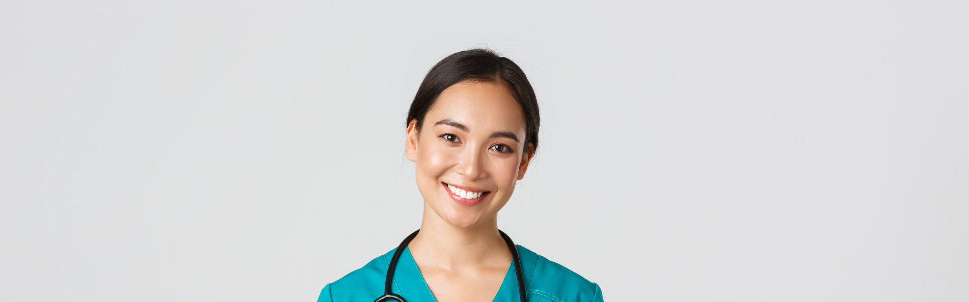 Beautiful nurse with a stethoscope on her neck smiling
